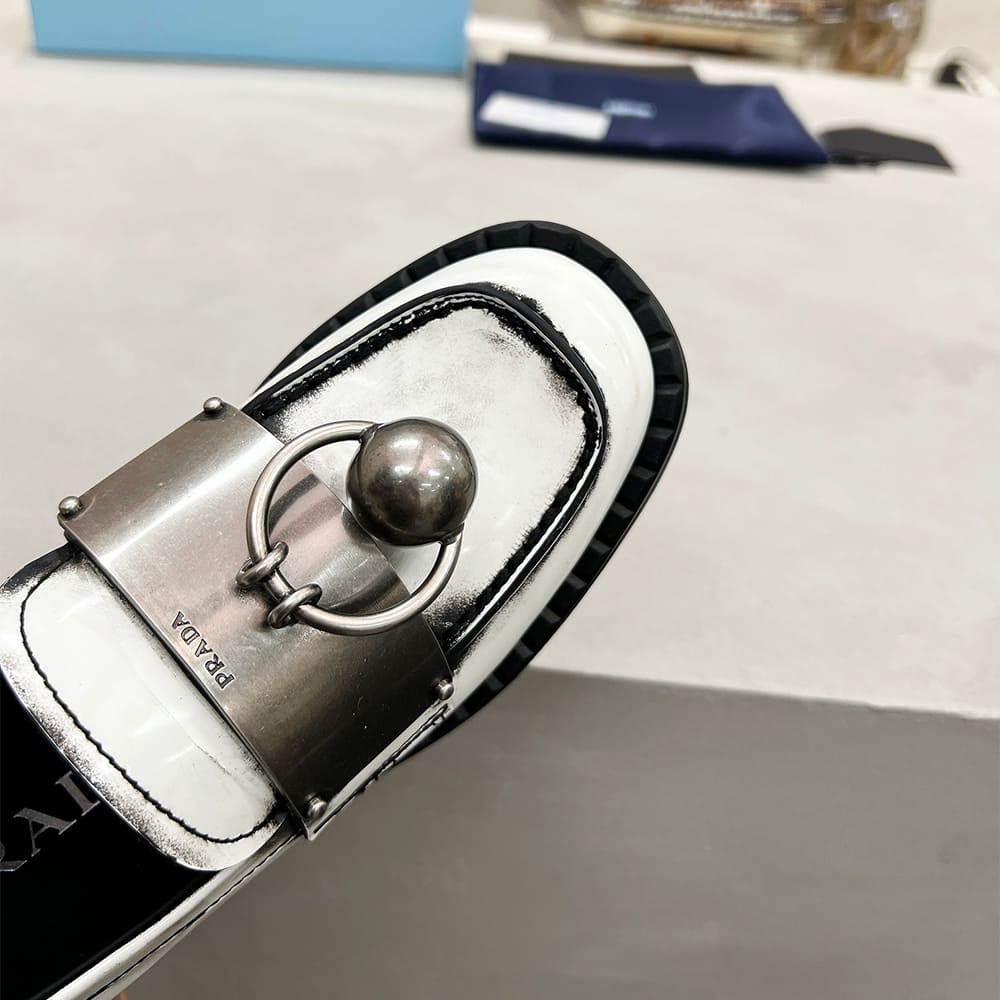 PRADA Brushed leather loafers with metal details