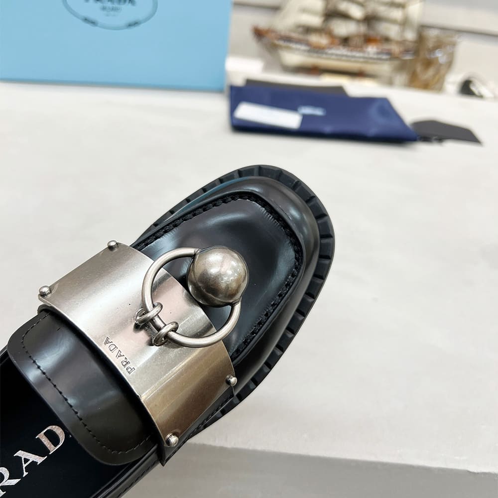 PRADA Brushed leather loafers with metal details